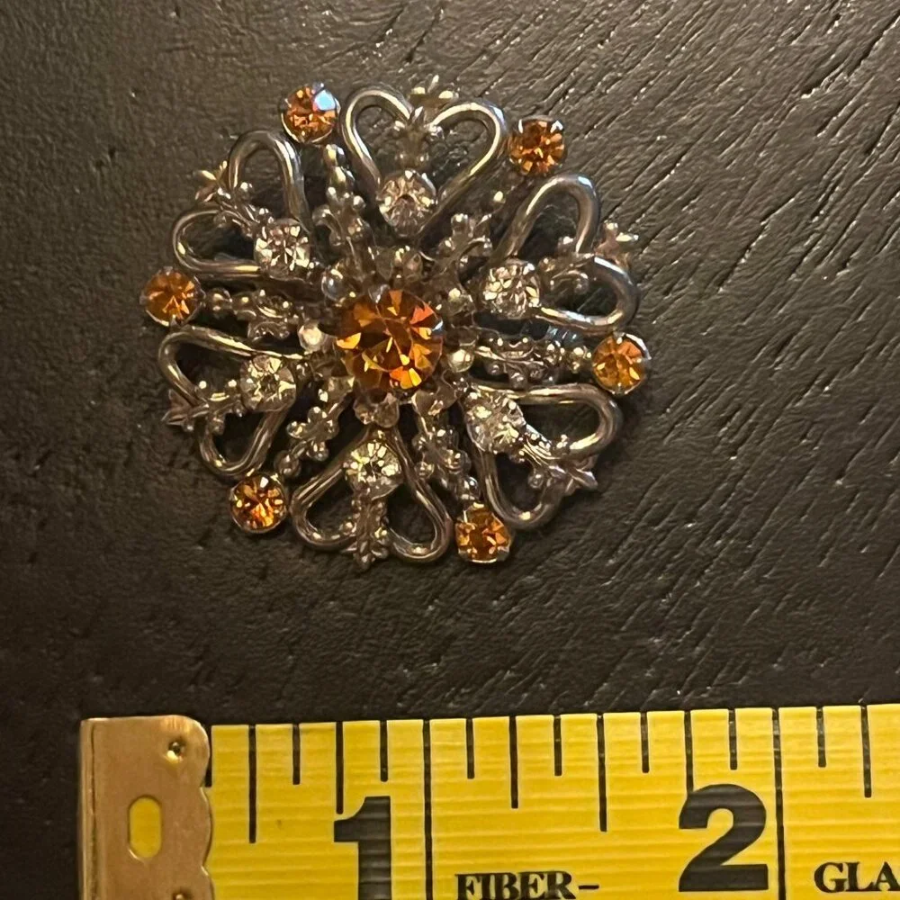 Vintage Gold Tone Starburst Brooch with Amber Topaz and Clear Rhinestones